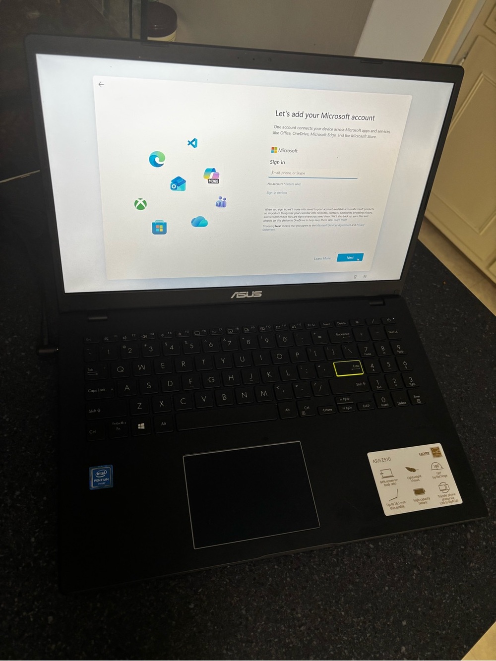 ASUS Black Laptop with Yellow-Accent Key